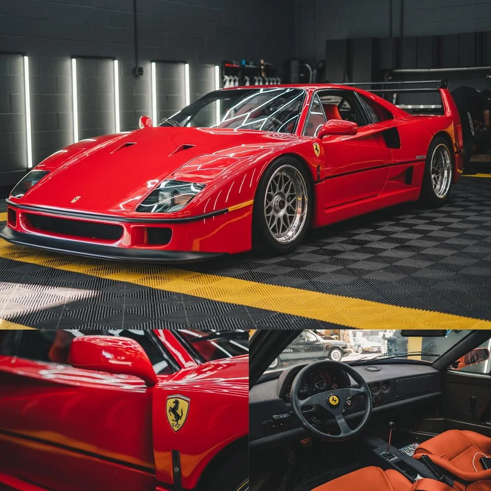 Rear three-quarter view of a red Ferrari F40 inside the Artec Automotive workshop