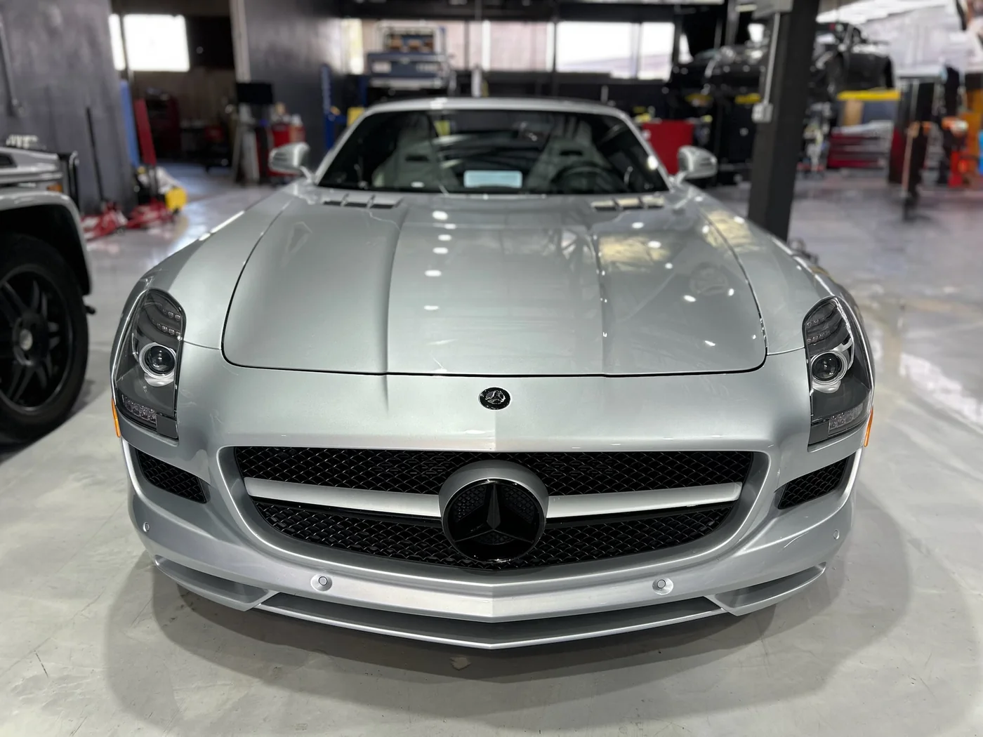 Silver Mercedes-Benz SLS AMG with paint protection film on the front end
