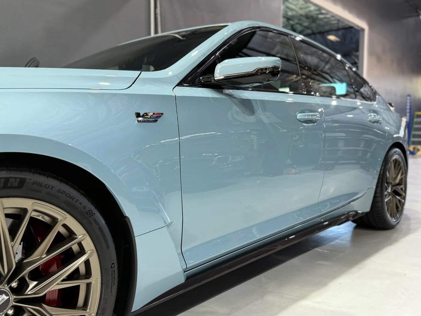 Light blue Cadillac CT5-V Blackwing with mirror-finish paint after ceramic coating