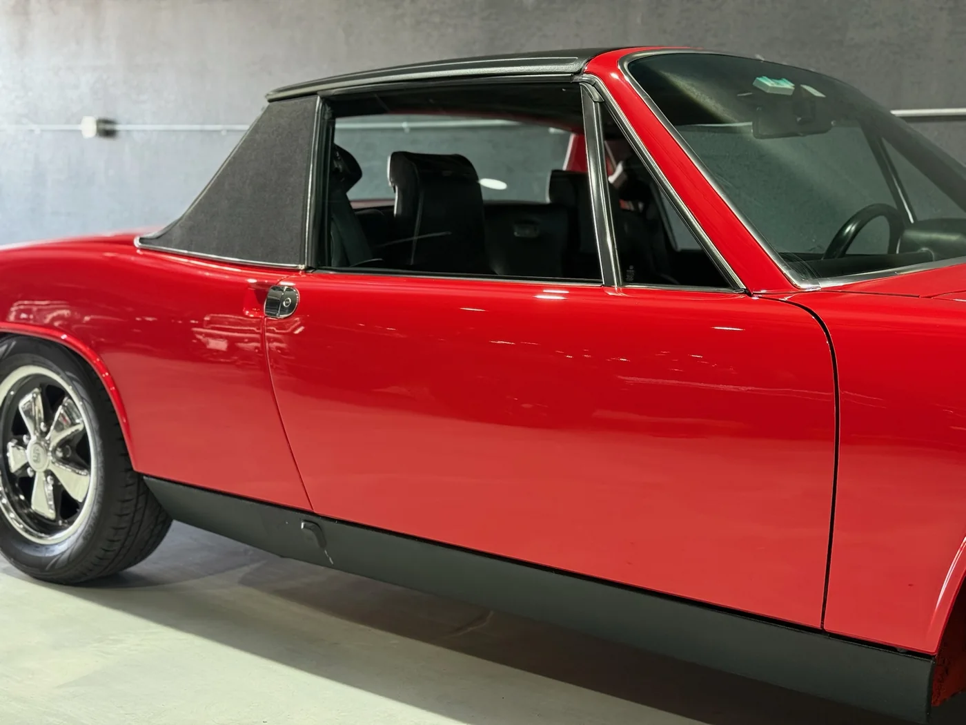 Red classic Porsche 914 with restored gloss after paint correction at Artec Automotive