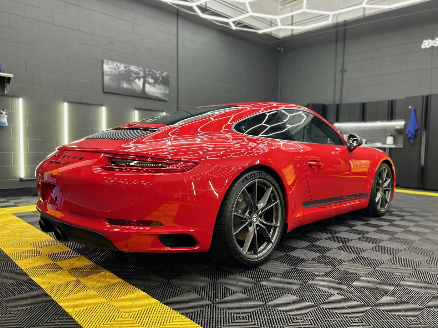 Red Porsche 911 with corrected paint in the Artec Automotive detailing bay
