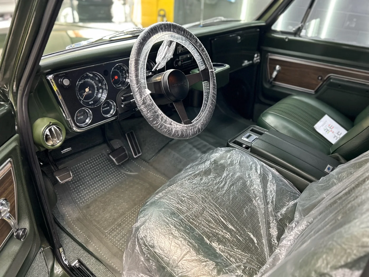 Classic car interior with the seats protected during a full detail at Artec Automotive