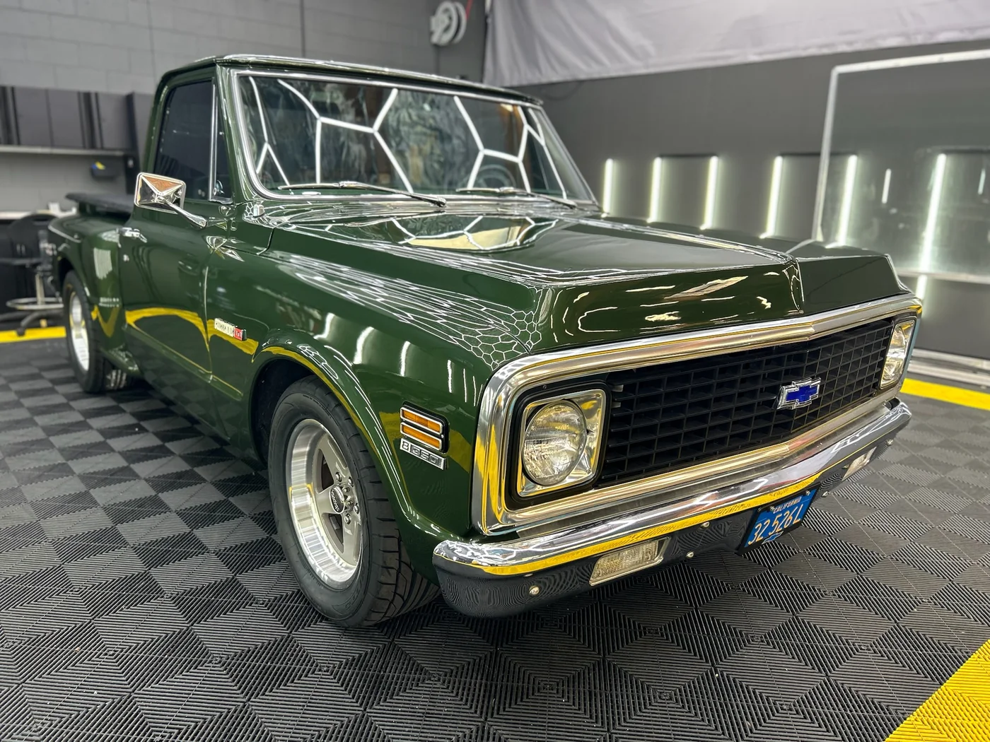 Restored green Chevrolet C10 pickup truck at Artec Automotive in Belmont, CA