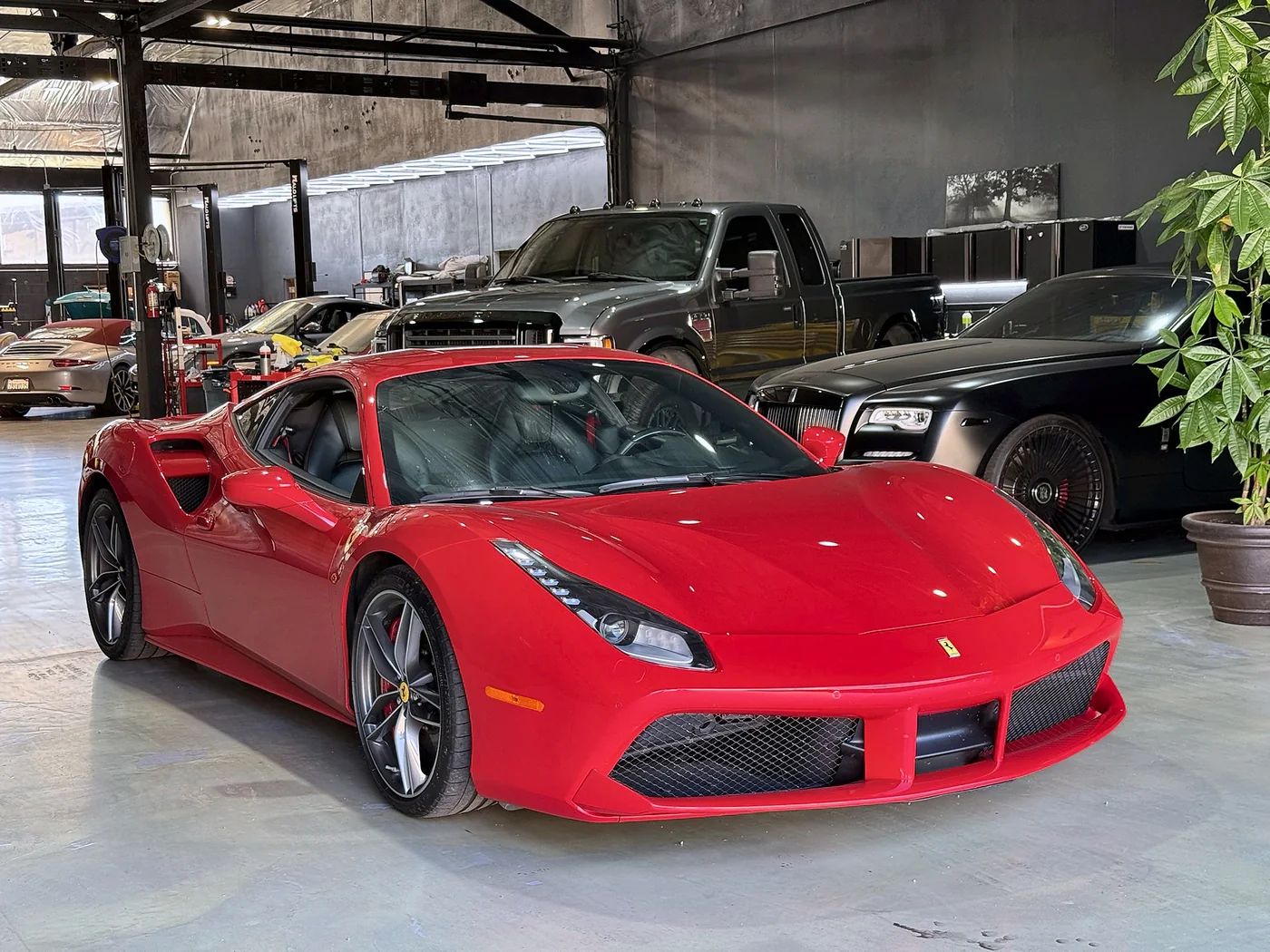 Red Ferrari 488 Spider parked in the Artec Automotive workshop in Belmont, CA
