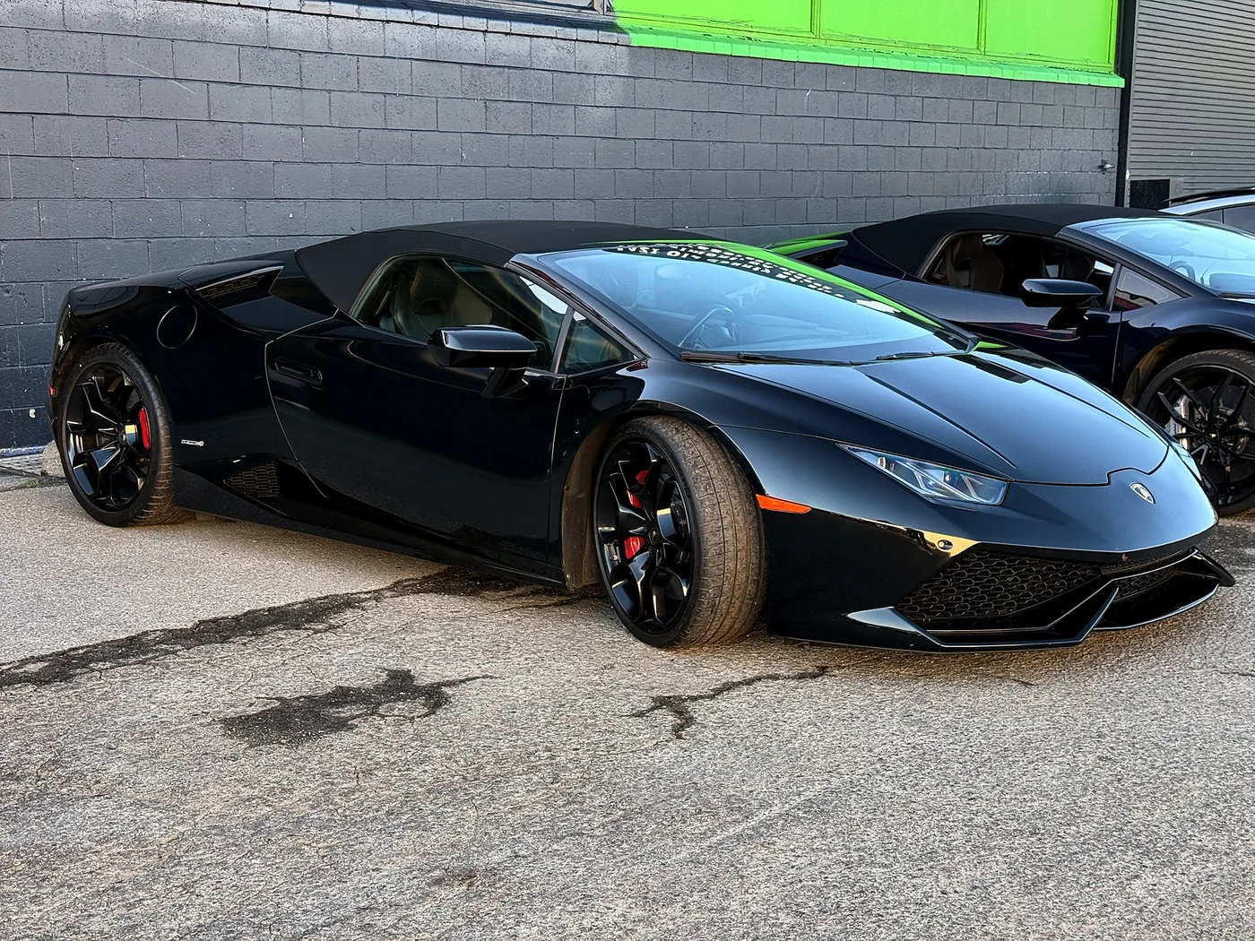 Black Lamborghini Huracan parked inside the Artec Automotive workshop