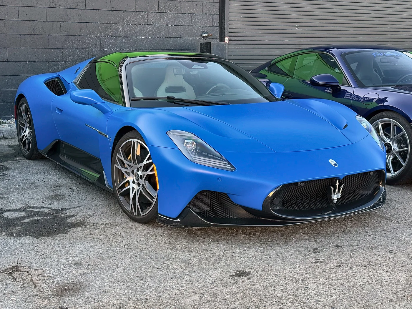 Blue Maserati MC20 outside the Artec Automotive shop in Belmont, CA