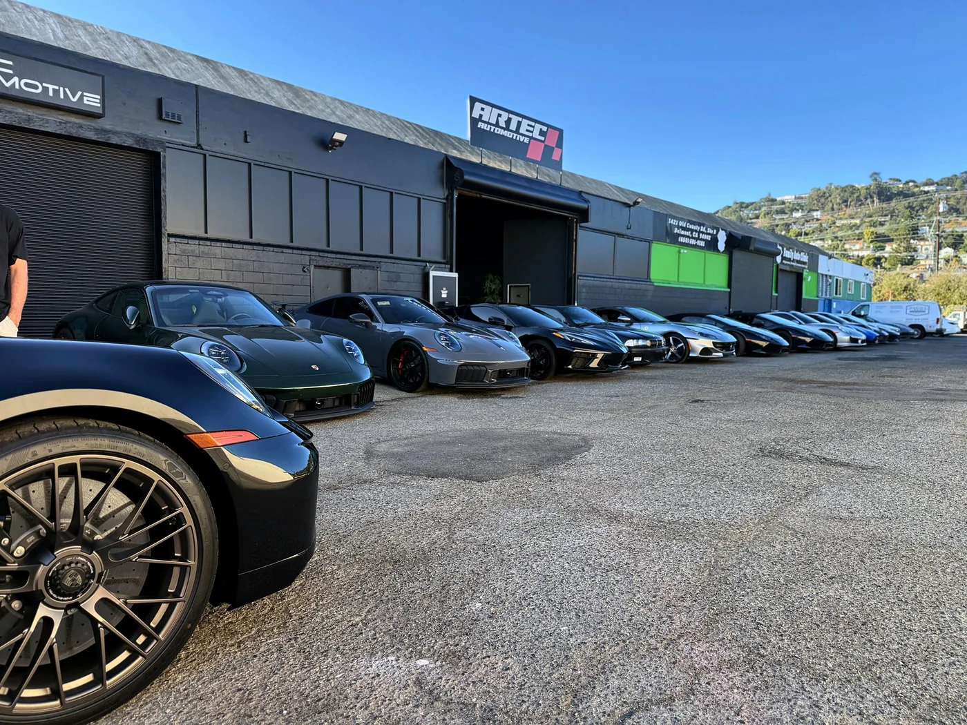 Row of Porsche sports cars parked at Artec Automotive in Belmont, CA