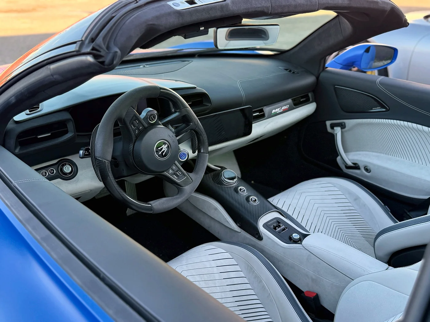 White leather interior and dashboard of a convertible sports car