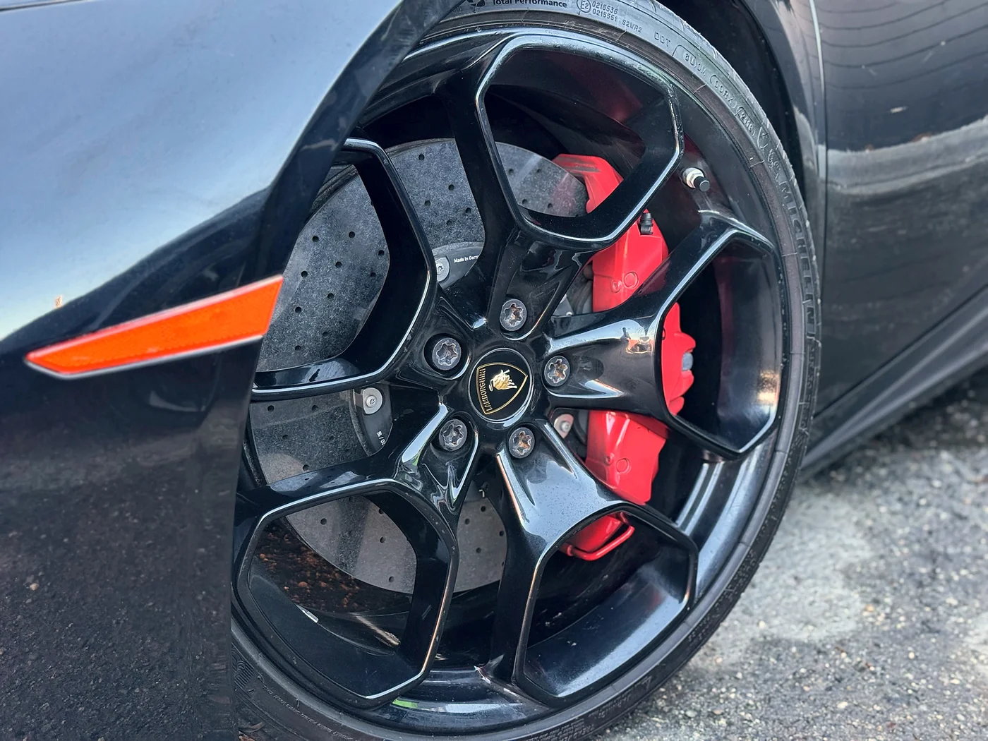 Lamborghini wheel and red brake caliper detail