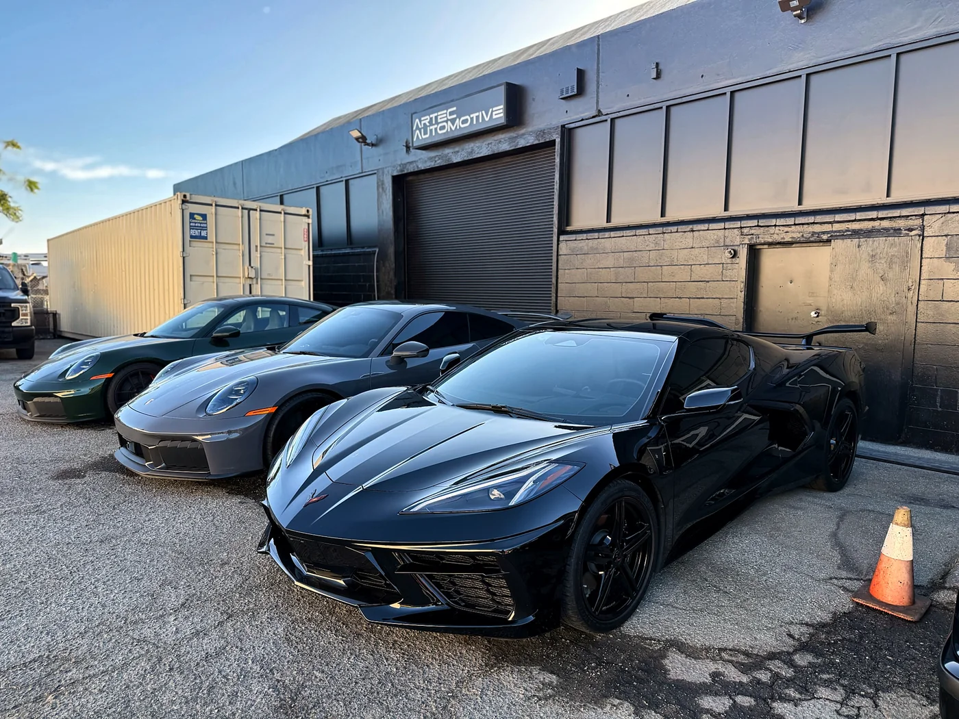 Black Chevrolet Corvette C8 parked outside the Artec Automotive shop