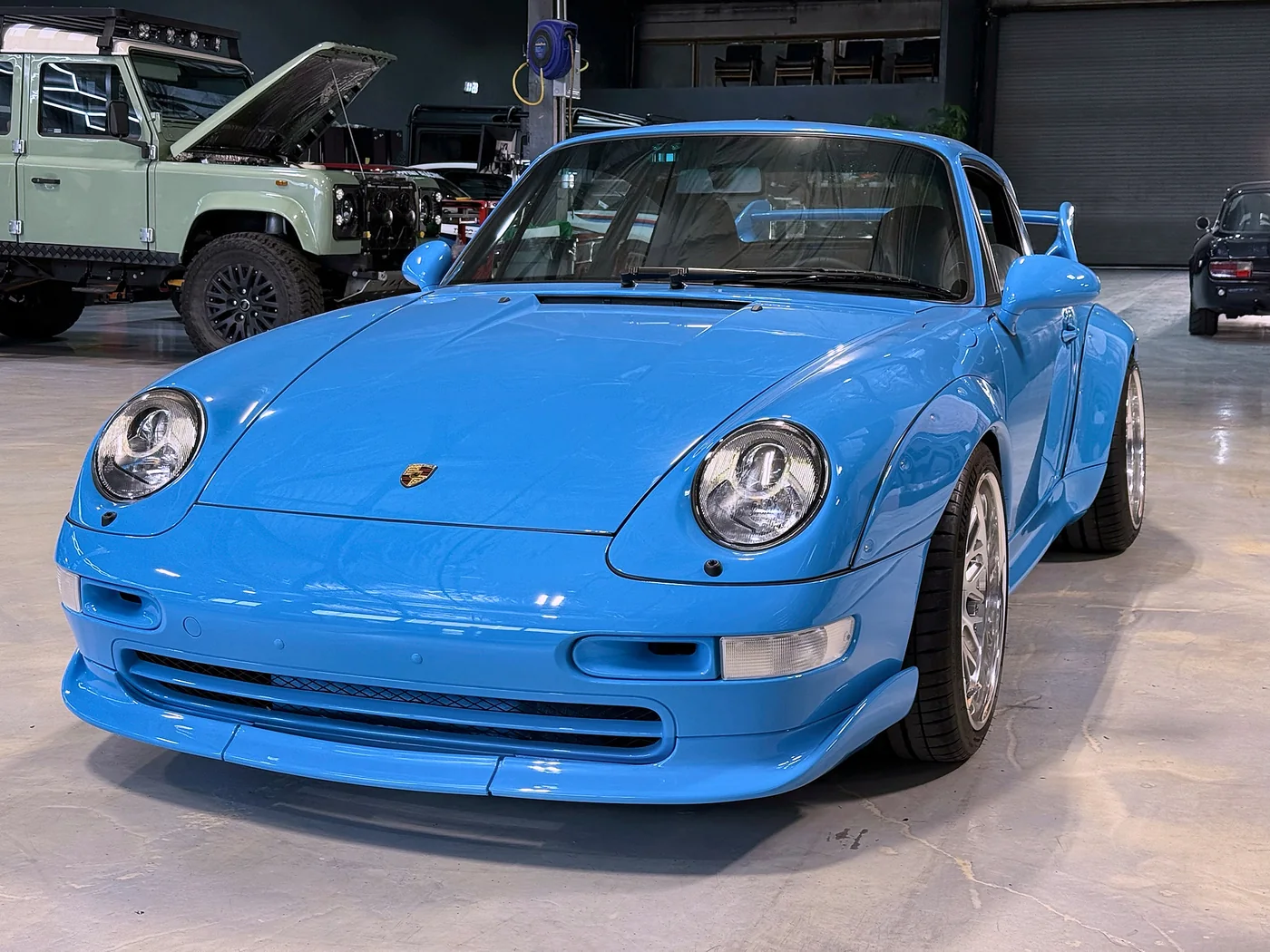Riviera Blue Porsche 993 RS with silver split-rim wheels at Artec Automotive