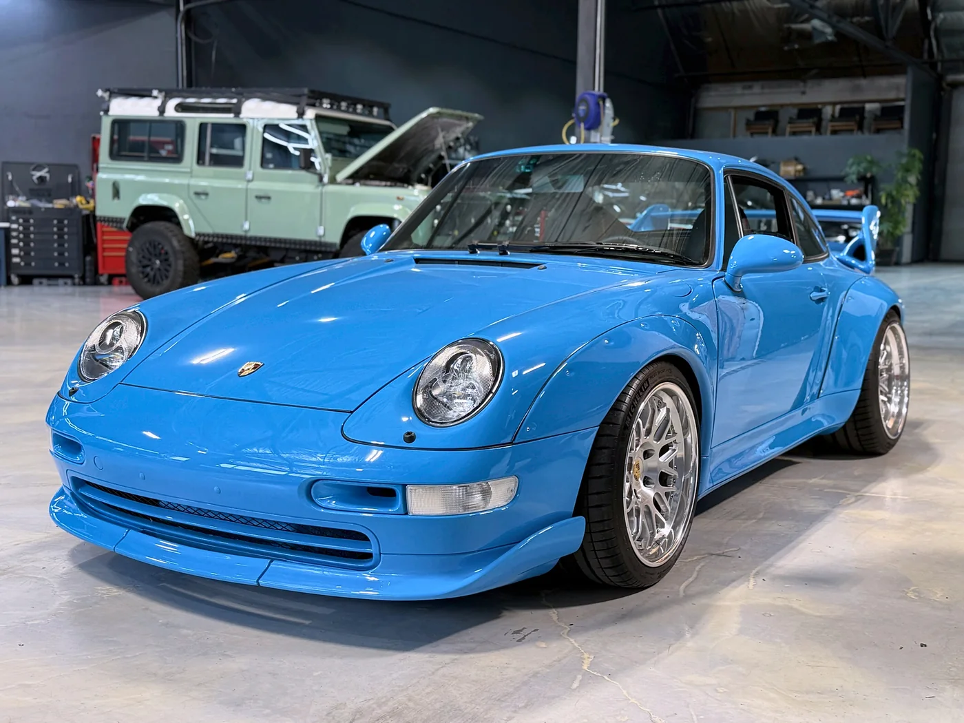 Riviera Blue Porsche 993 RS photographed side-on in the Artec Automotive shop