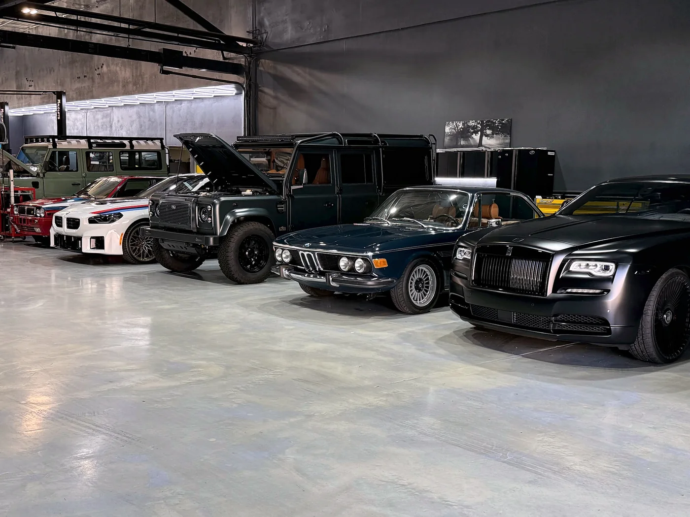 Vintage BMW and Mercedes classics parked together at Artec Automotive