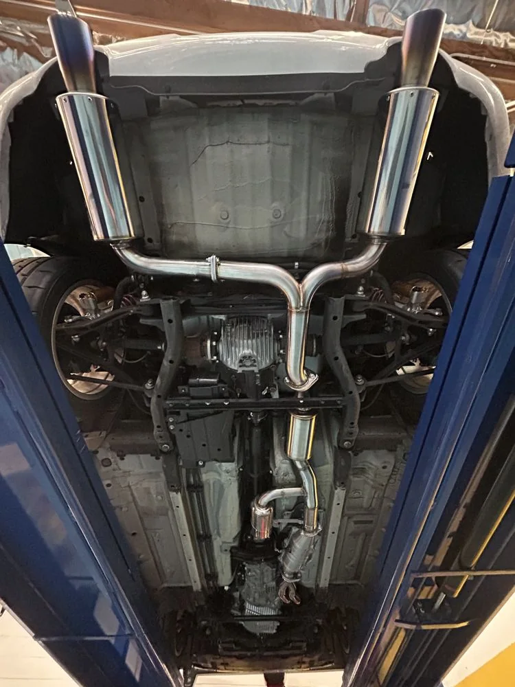 Underside view of a custom stainless exhaust system fabricated at Artec Automotive