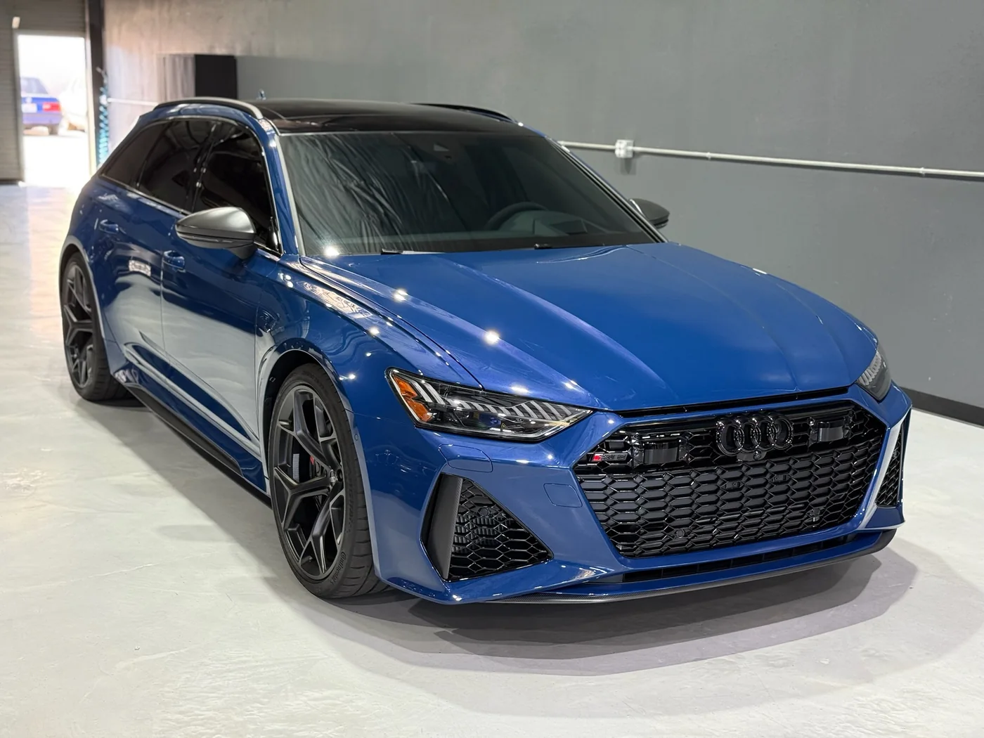 Blue Audi RS6 Avant parked in the Artec Automotive workshop in Belmont, CA