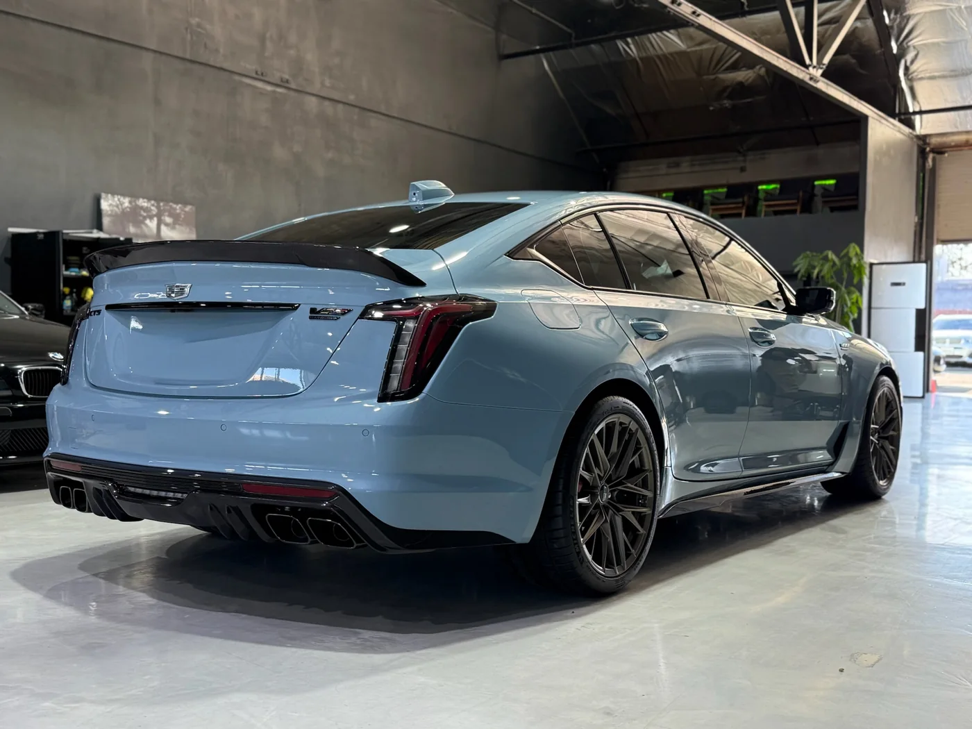 Light blue Cadillac CT5-V Blackwing on the workshop floor