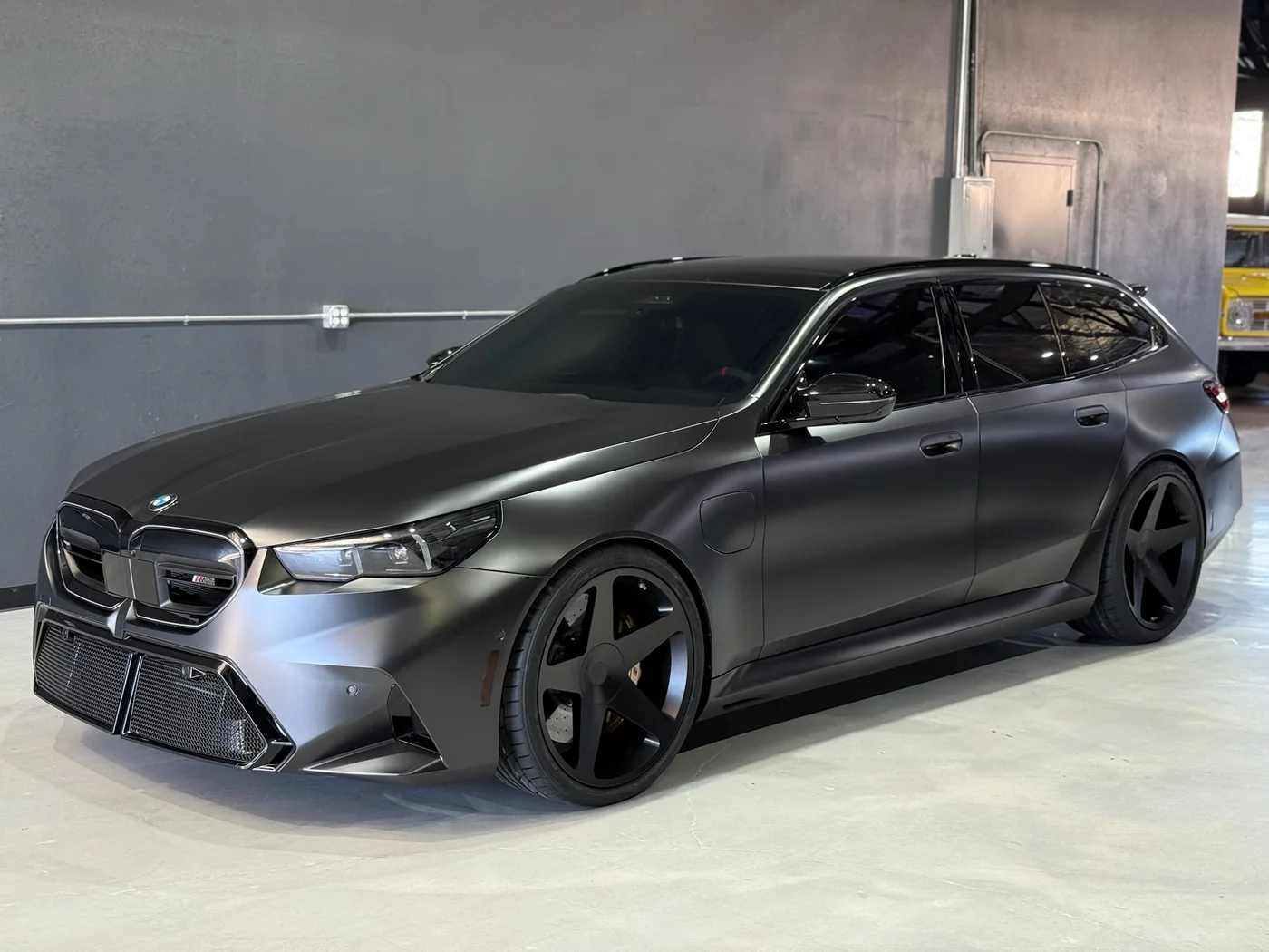 Matte grey BMW M5 Touring in for service at Artec Automotive