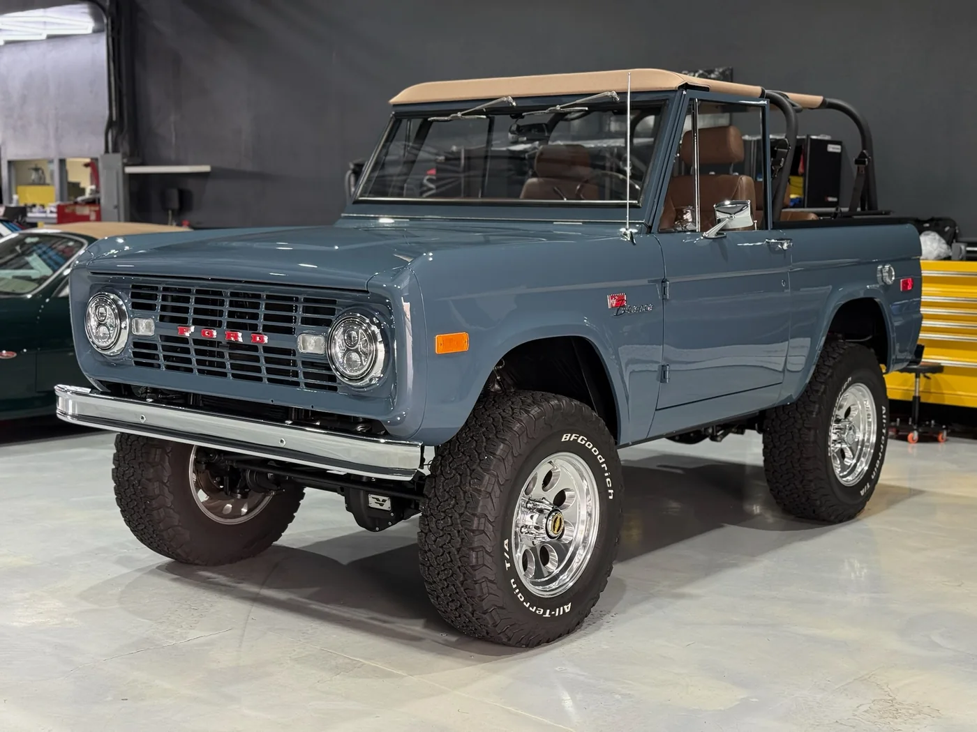 Restored early Ford Bronco in grey-blue with off-road tires