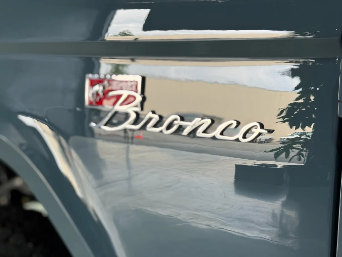Chrome Bronco badge detail on a restored early Ford Bronco