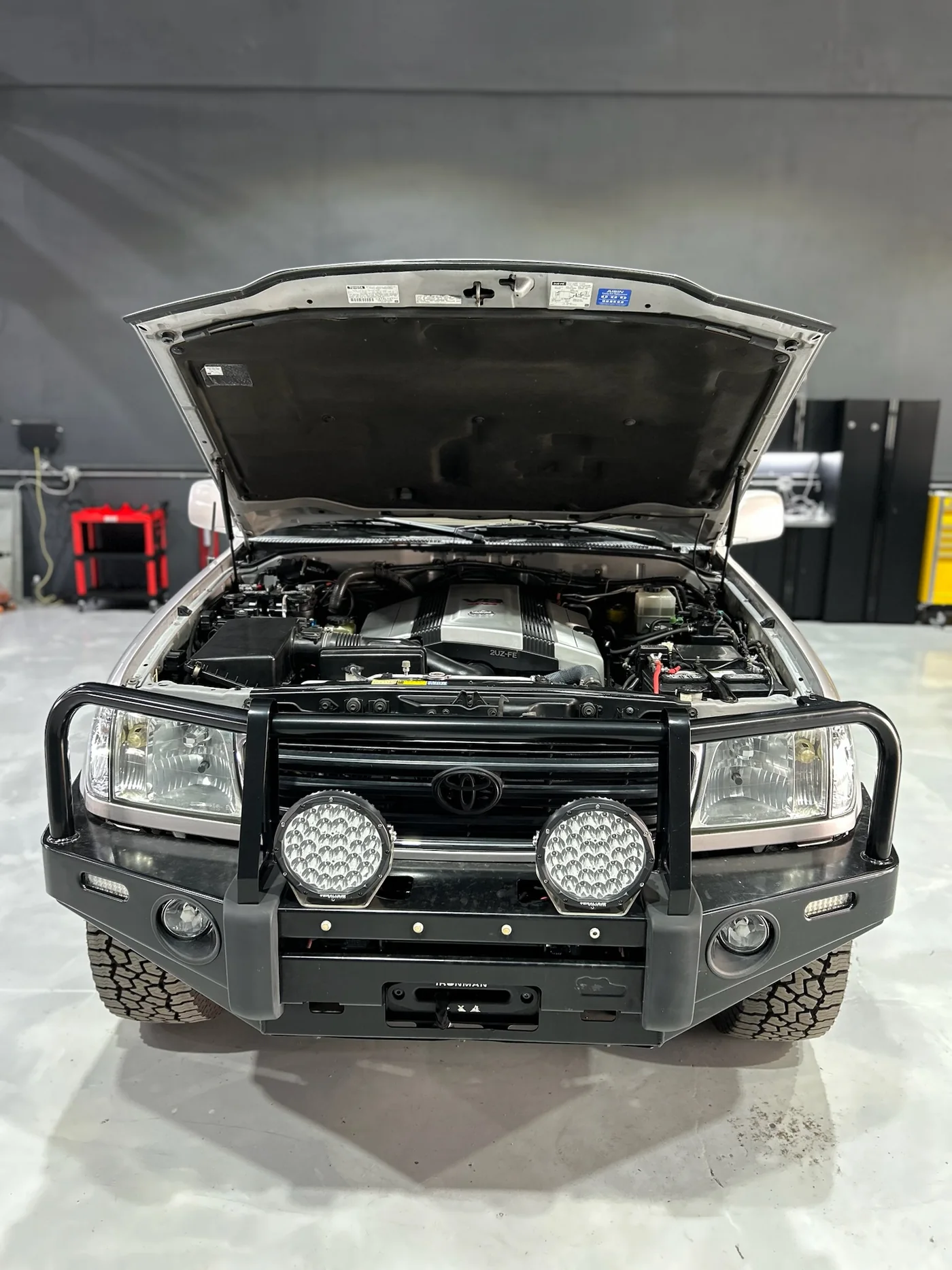 Engine bay of a Mercedes G-Class with the bonnet open during service