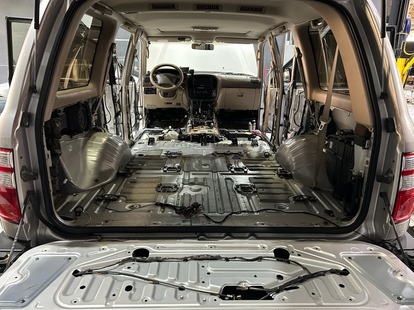 Stripped vehicle interior prepared for sound deadening and insulation
