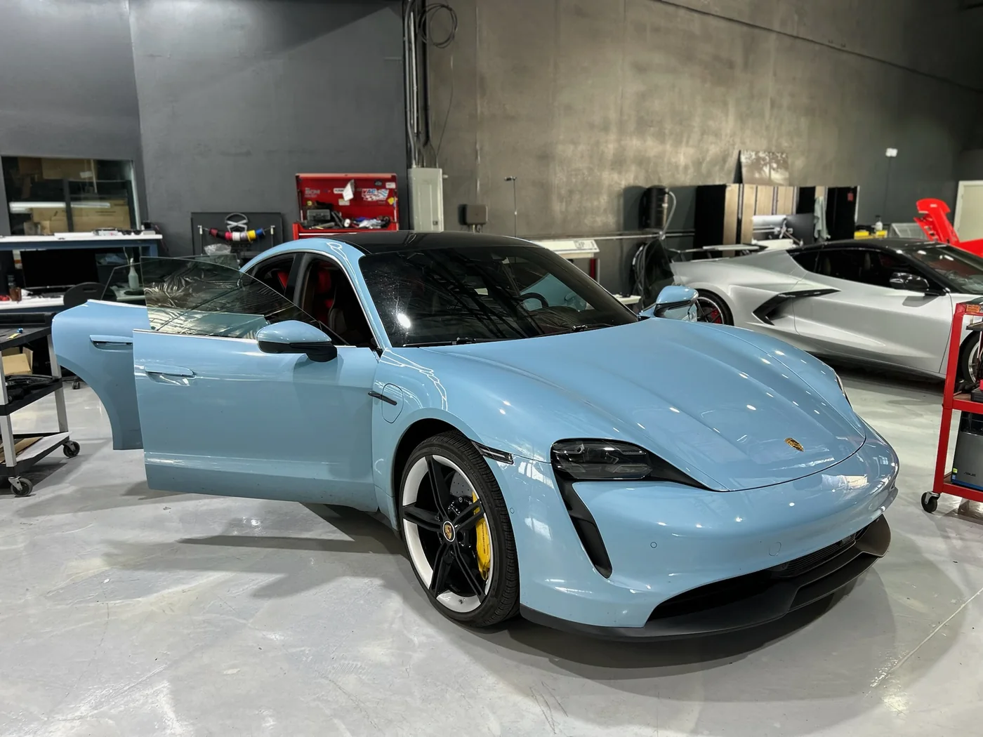 Light blue Porsche Taycan in the Artec Automotive service bay
