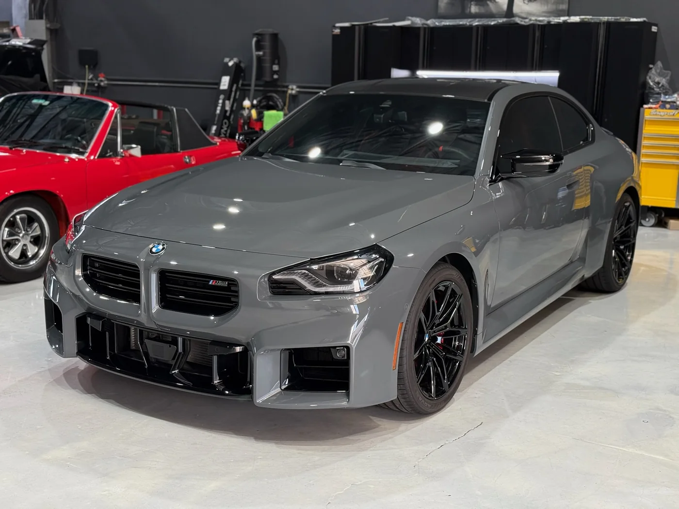 Grey BMW M2 with aftermarket wheels in the Artec Automotive shop