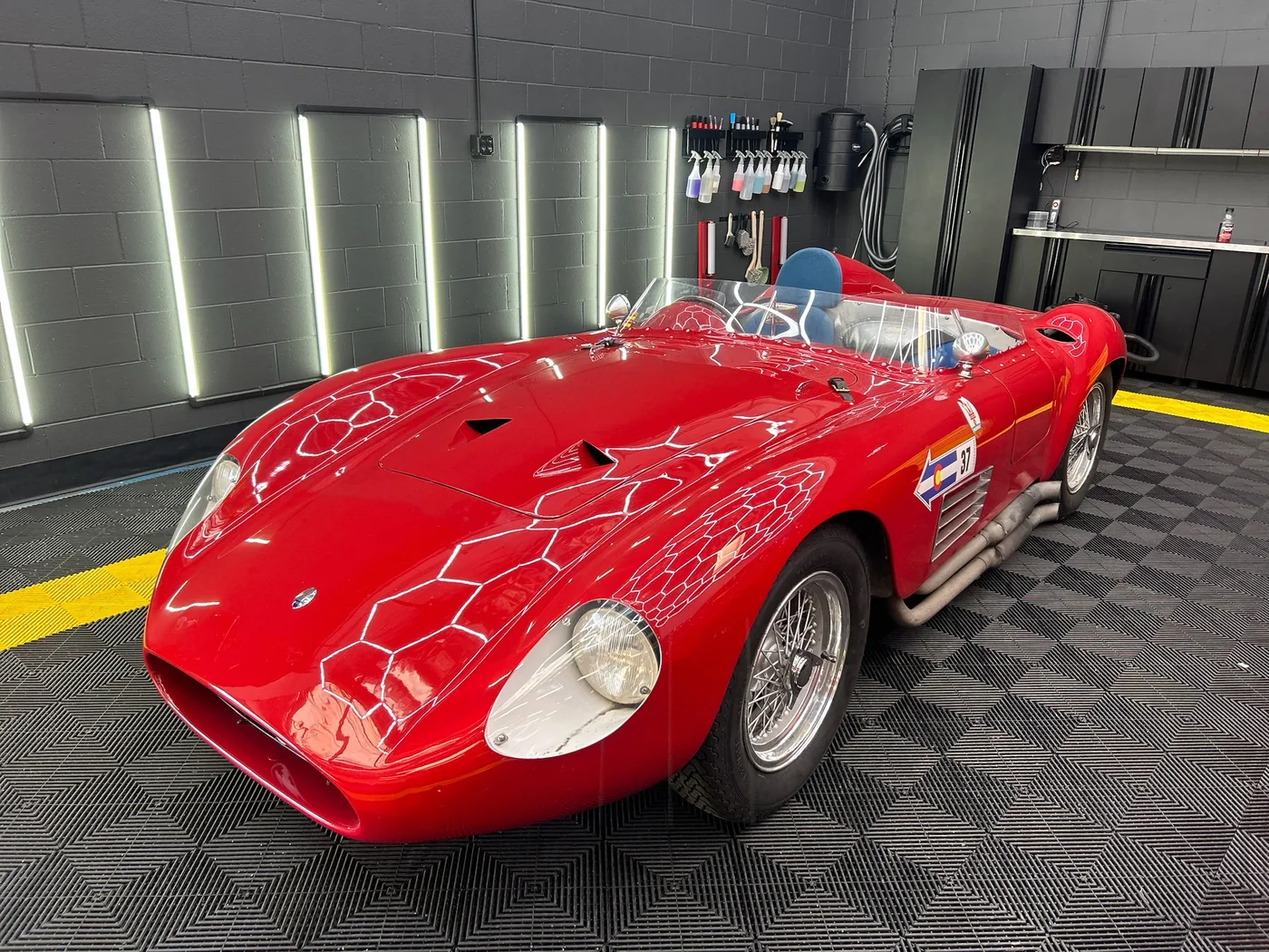 Red Ferrari 250 Testa Rossa style classic racer in the Artec Automotive shop