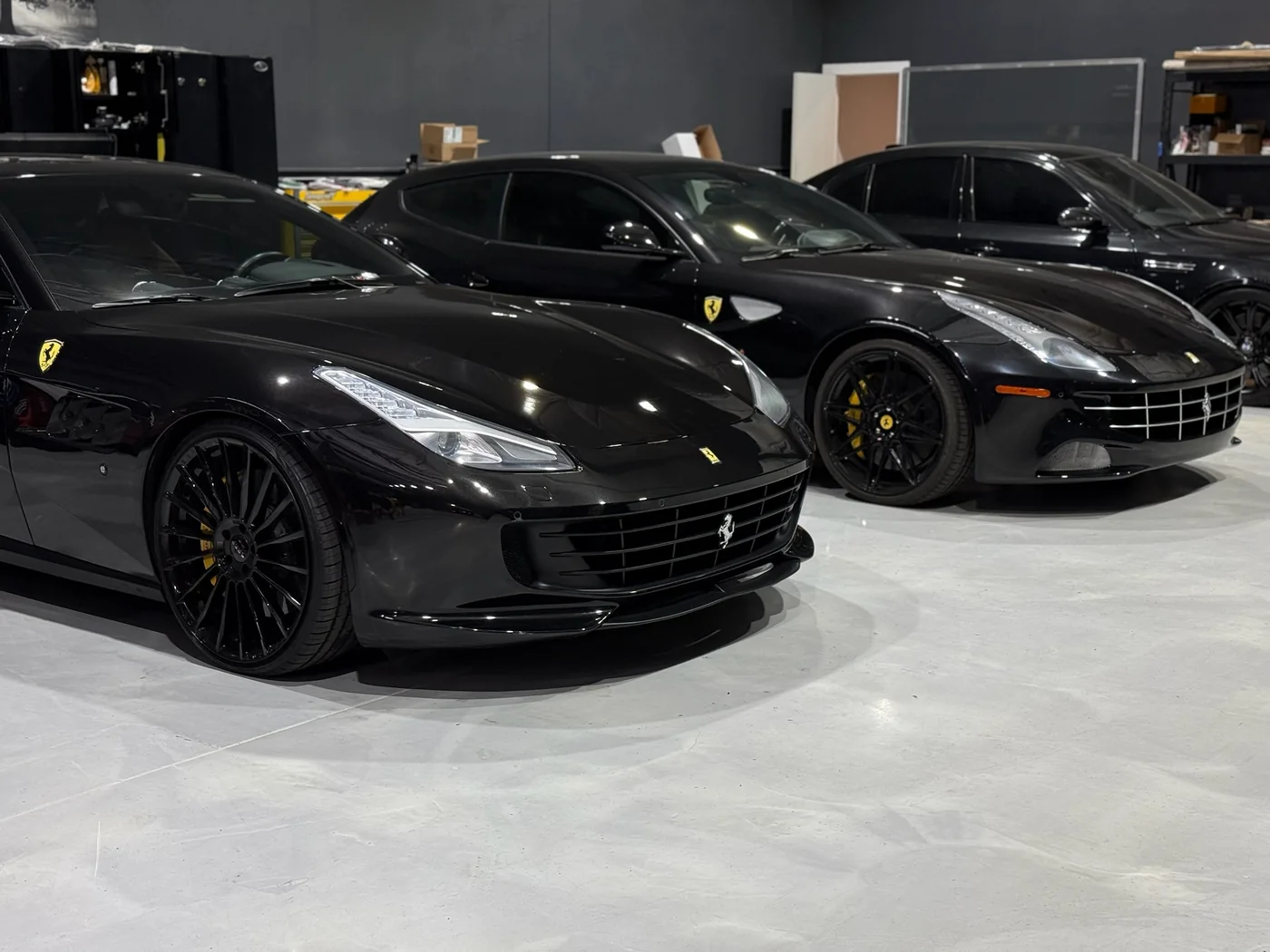 Black Ferrari 599 parked in the Artec Automotive service bay