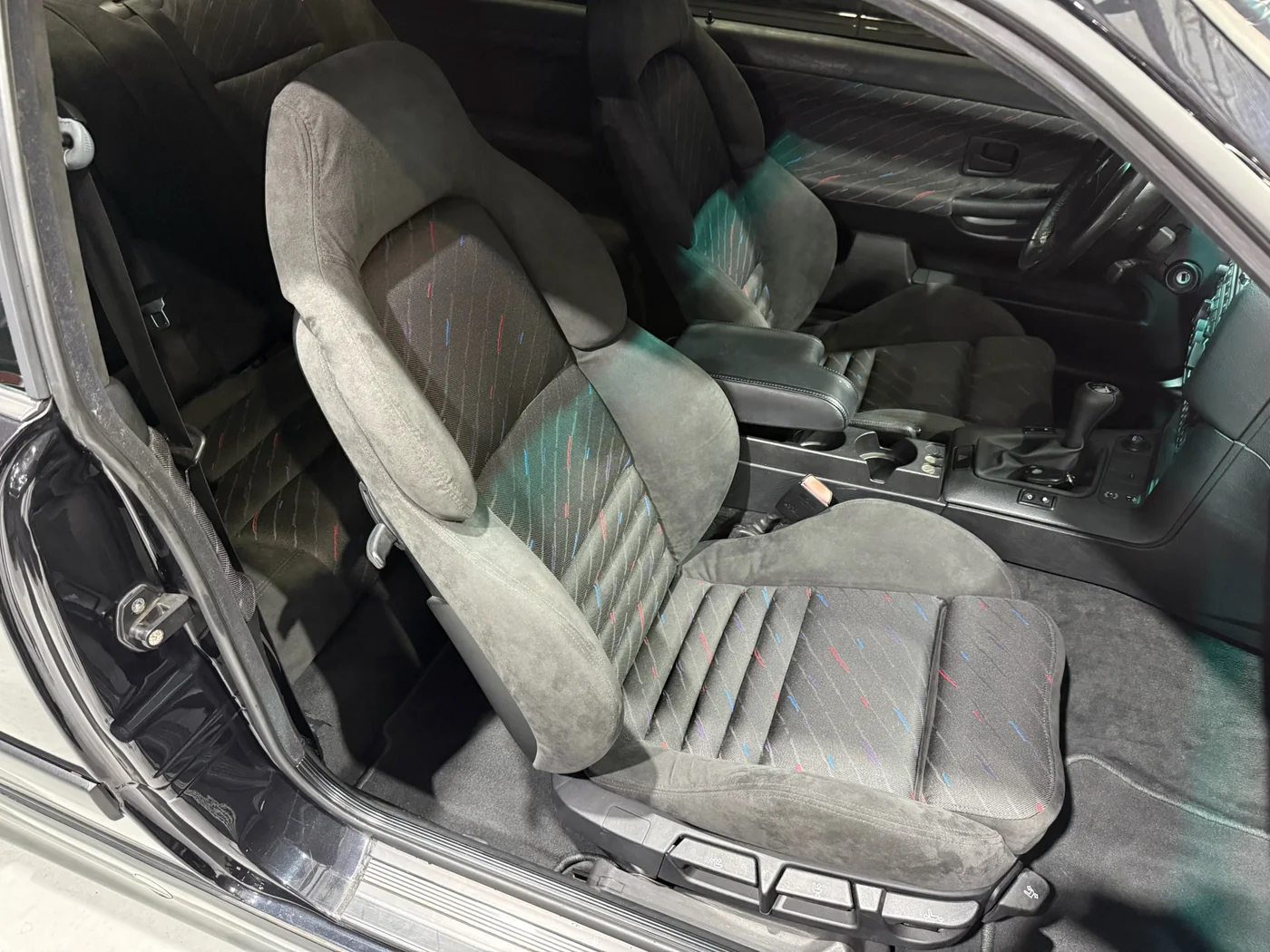 Grey leather interior of a classic Mercedes-Benz during restoration