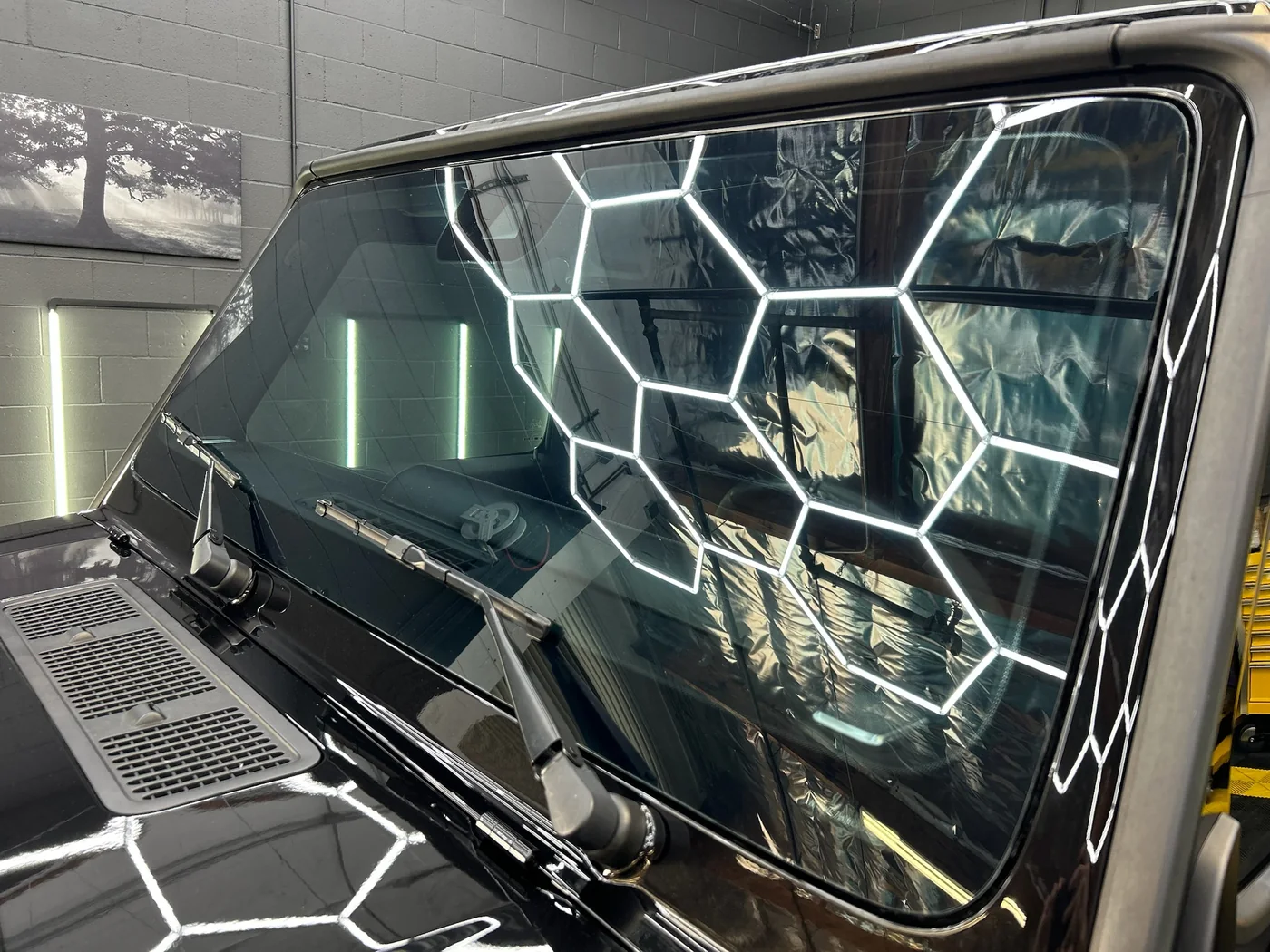 Window and trim detail of a black G-Class after protective film install