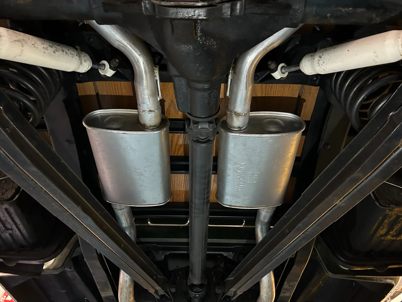Custom stainless exhaust system fitted under a vehicle at Artec Automotive